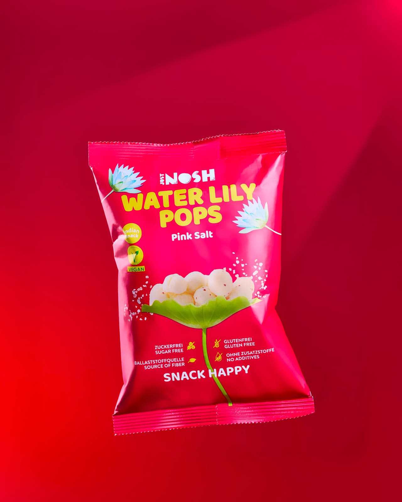 Water Lily Pops Pink Salt Beutel vor magentafarbenem Hintergrund